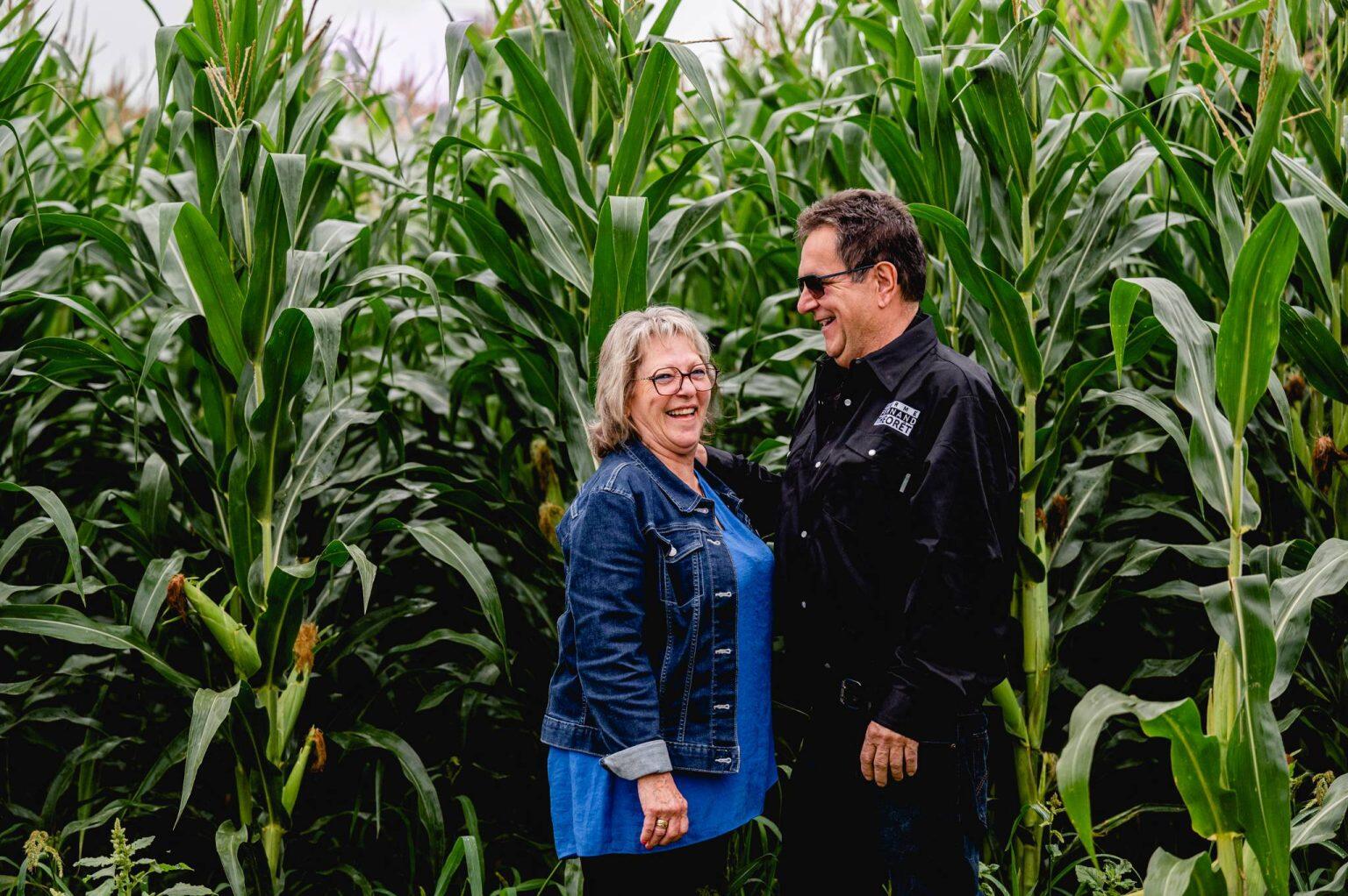 Ginette and Fernand posing together in their field