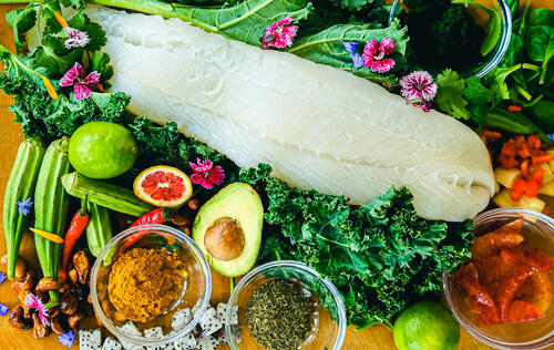 Callaloo (kale, spinach, and okra) with pan-fried cod